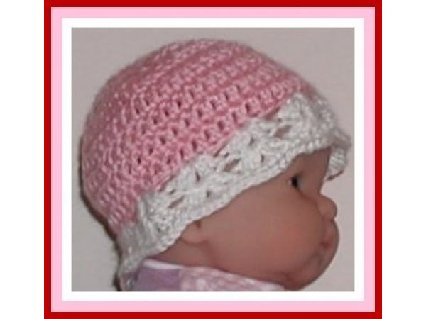 Pink and white hat for newborn girl with red flower