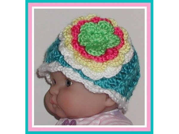 Turquoise hat for girls with big multi colored flower