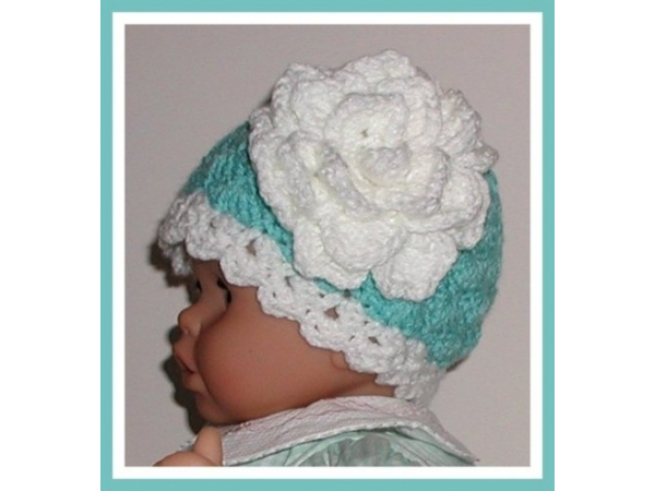 Pale turquoise baby girls hat with flower