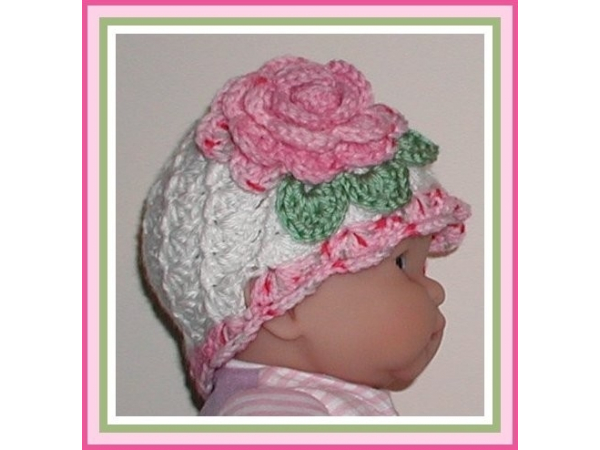 White baby girl hat with pink flower
