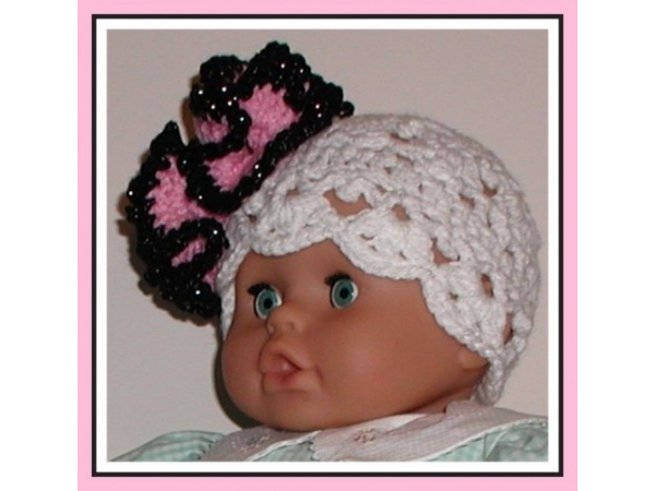 White lace baby girl hat with extra large hot pink and black fascinator flower