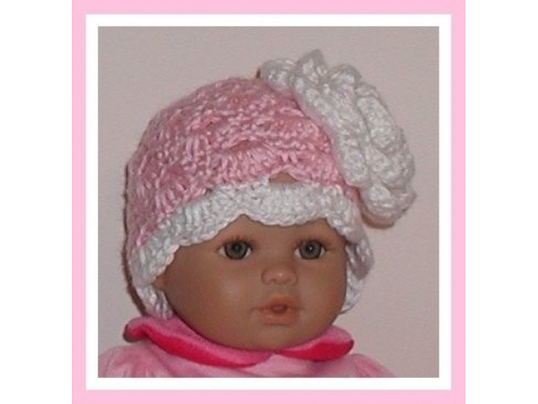 Pink and white preemie girls hat with a large flower