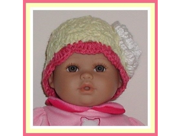 Yellow and pink preemie girls hat with a white flower