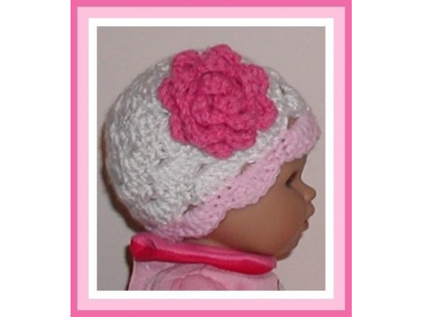 pink and white preemie girls hat with a dark pink flower