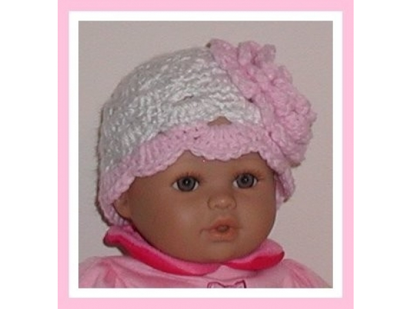 pink and white preemie hat with a large flower