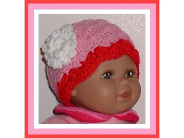 pink and red preemie girls hat with a white flower