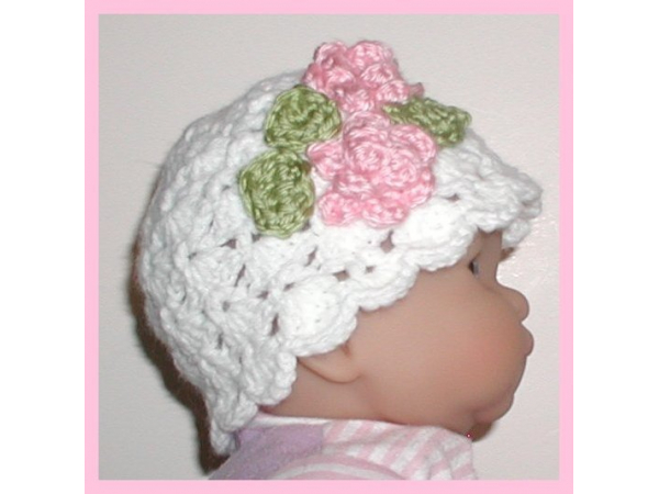 white newborn girls hat pink flowers