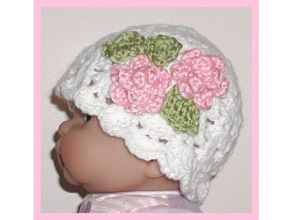 white hat for newborn girl with pink flowers