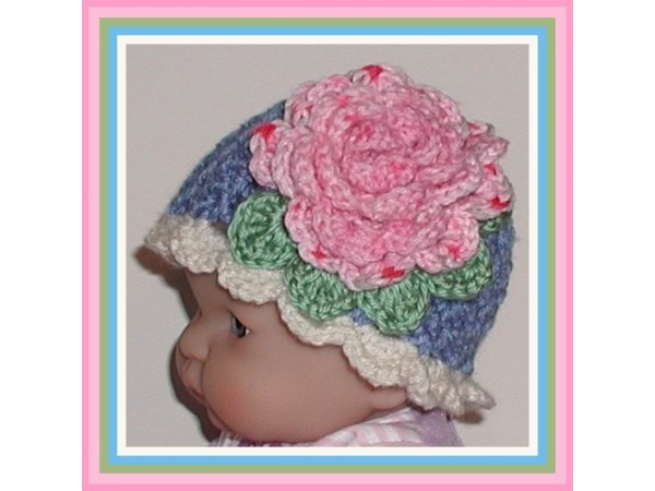 blue hat for baby girls with a big pink flower