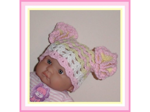 newborn girl hat in pastel pink light yellow and white