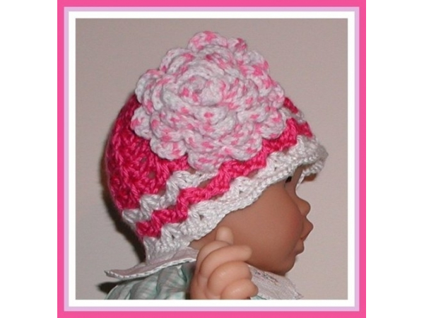 shocking pink hat for baby girls with a large flower