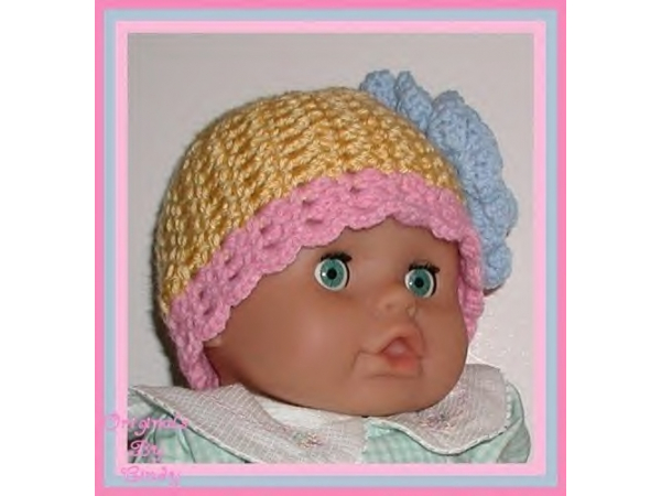 yellow and pink hat for baby girls with large blue flower