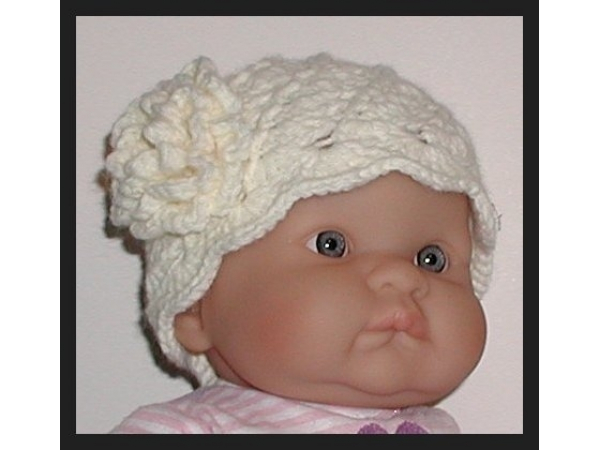 cream baby girl hat with a flower