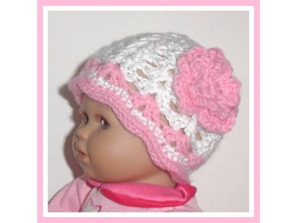 pink and white preemie girls hat with a flower