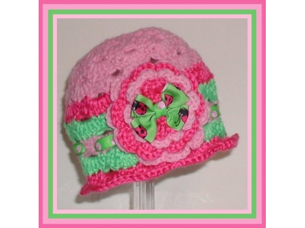 pink and lime green baby girls hat with ladybugs