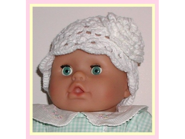 solid white hat for baby girls with a flower