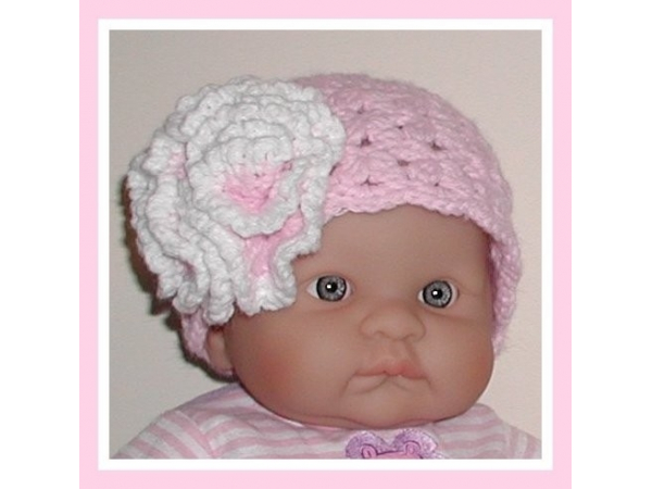 pink newborn hat with white flower