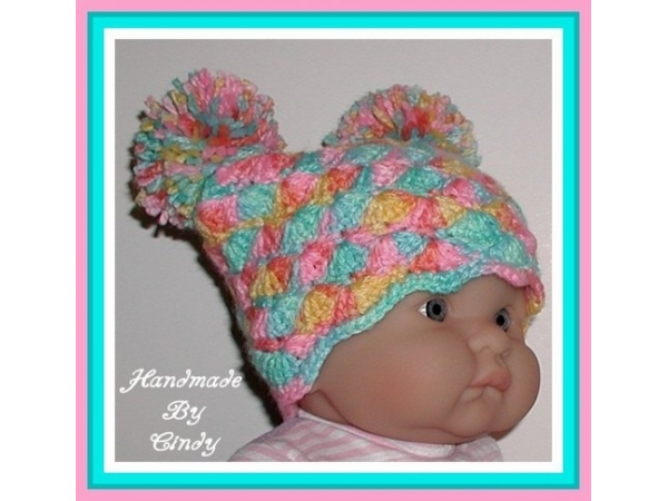 aqua blue pink baby girl hat with pom poms