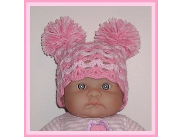 pink baby hat with pom pom