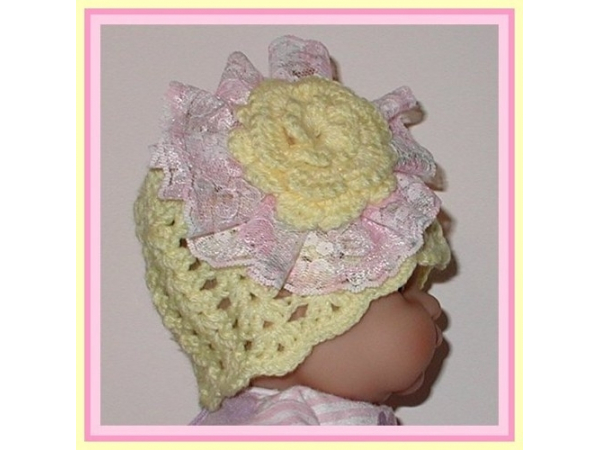 newborn girl yellow hat with pink flower