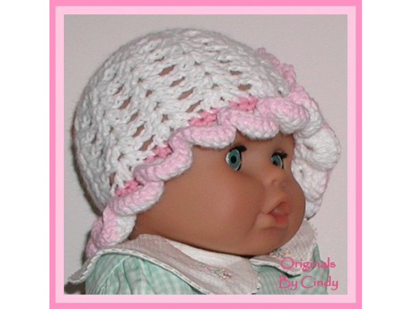white baby girls hat with pink flower