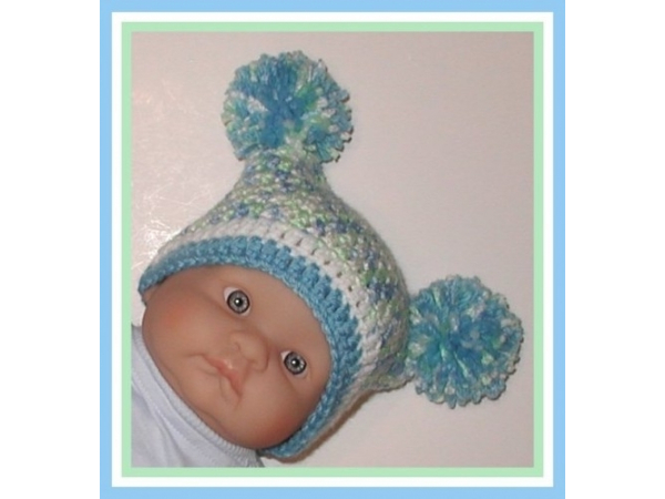 baby boys hat with blue and green pom poms