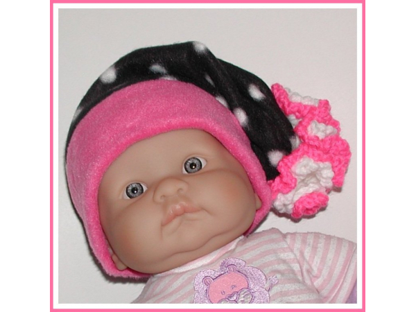 black white polka dot newborn girl elf hat with large hot pink and white flower
