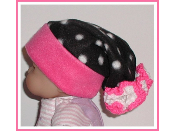 black and white polka dot hat for newborn girls with hot pink flower