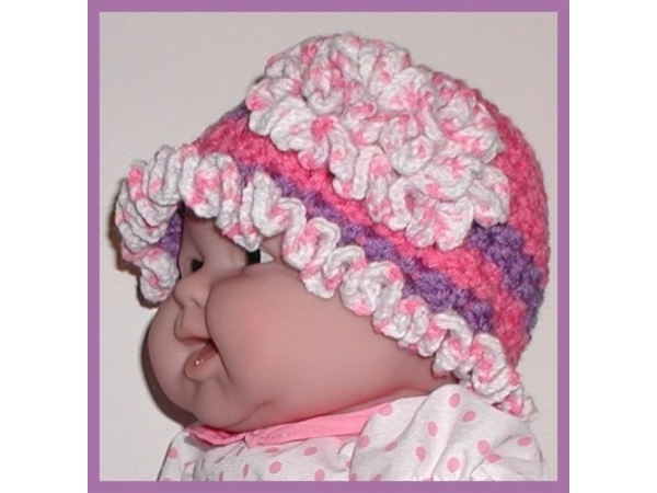 purple and strawberry pink hat for baby girls with a large fascinator flower