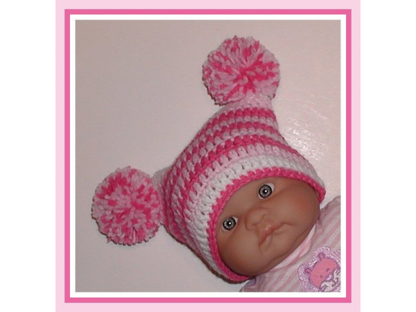 shades of pink newborn girl hat with pom poms