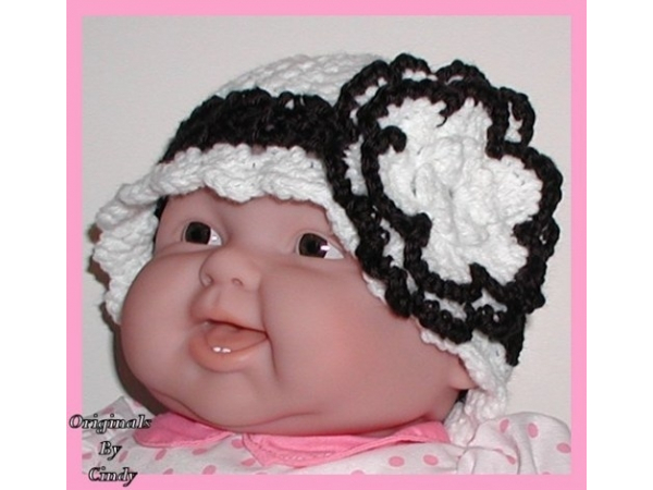 black and white toddler hat with a big flower