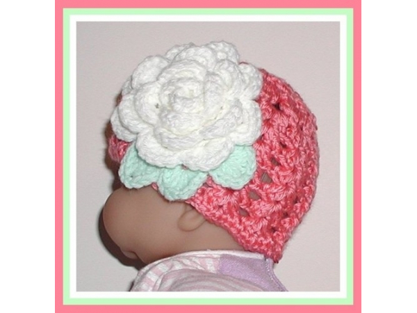 coral pink newborn hat with white flower