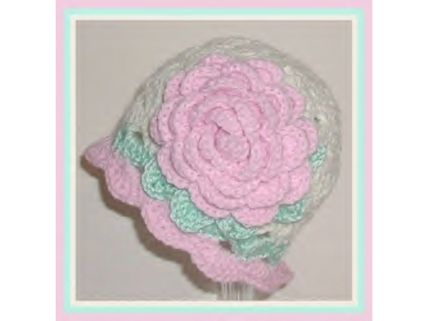 Cream baby hat with pink flower