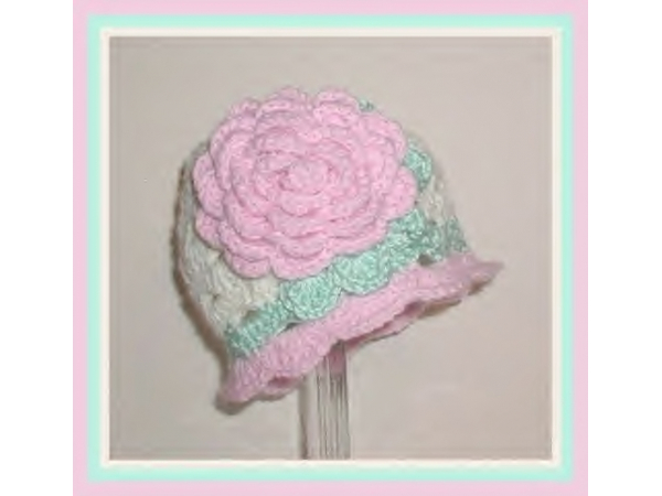 Cream toddler hat with pink flower