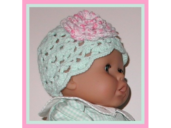 pink and light green baby hat
