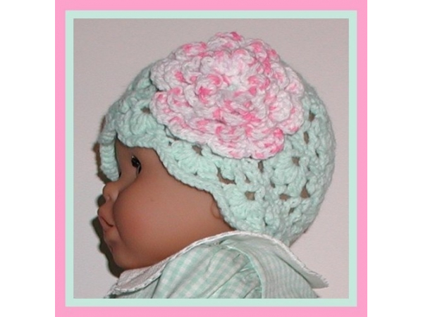 Mint green baby girls hat with big pink flower