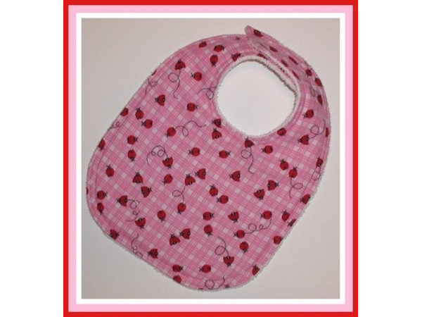 pink baby girl bib with ladybugs