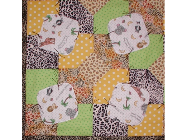 baby quilt with a zoo theme