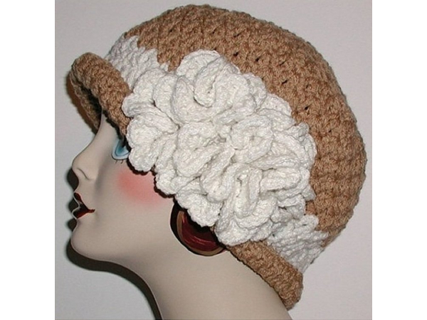 tan women's hat with extra large fascinator flower