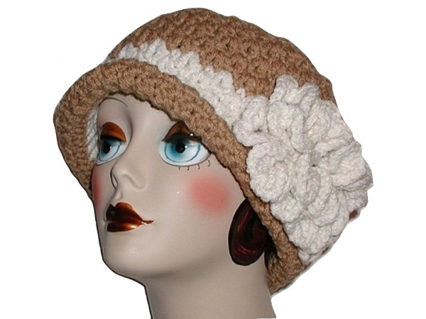 tan women's hat with cream flower