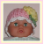 Pink baby hat with a yellow flower