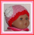 pink and red preemie girls hat with a white flower