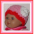 pink and red hat for preemie girl has a white flower