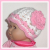 pink and white preemie girls hat with a flower