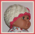 coral and cream baby girls hat