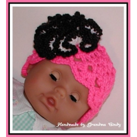 Neon pink and black hat for babies