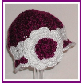 Baby girls hat in purple and white