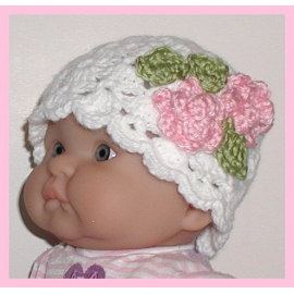 white newborn hat with pink flowers