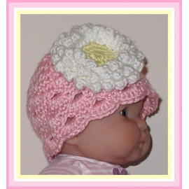 pink newborn hat with white and yellow flower
