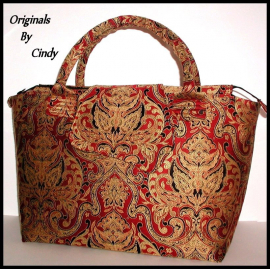 red and gold carpet bag
